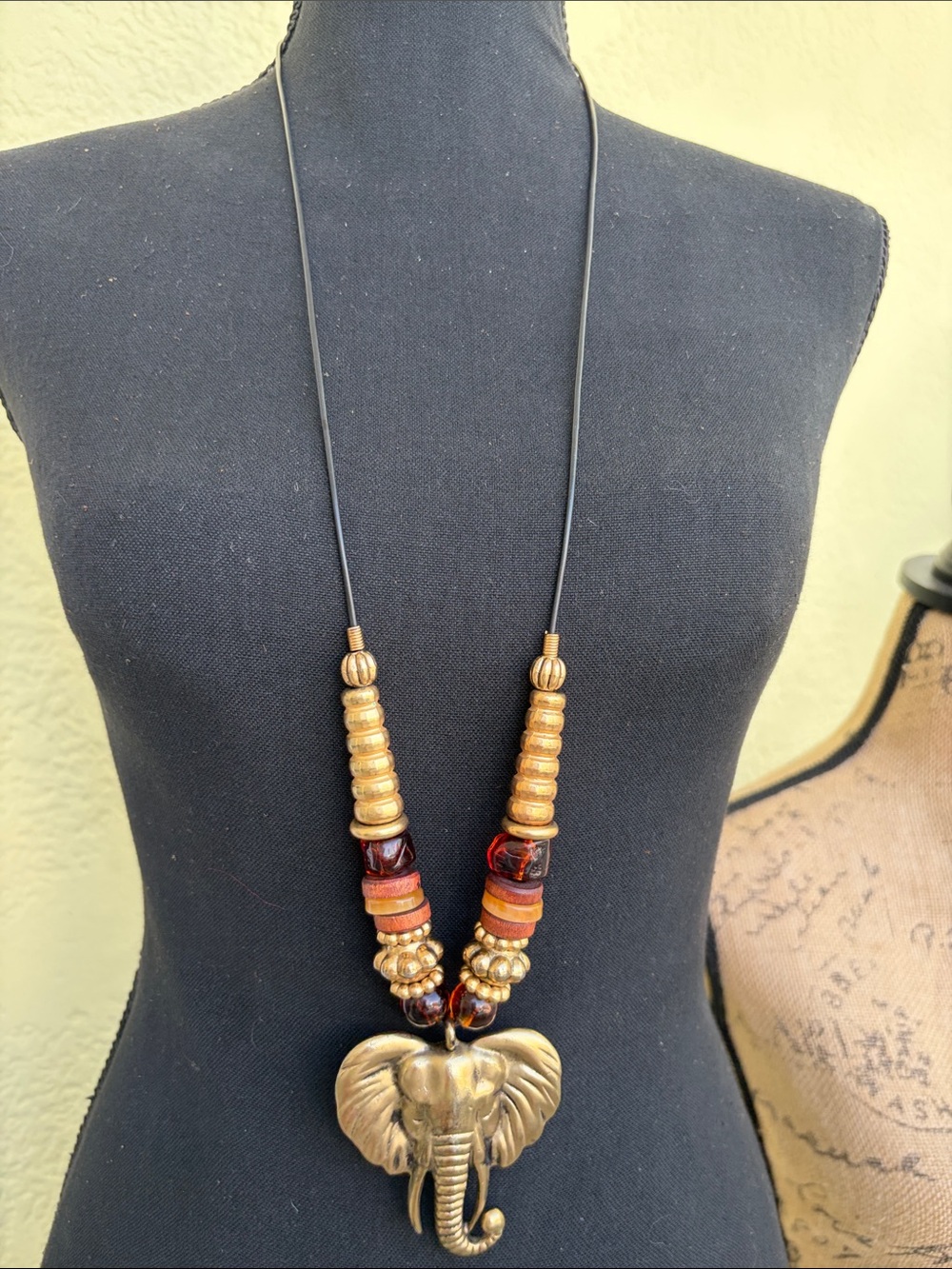 Brass Elephant Pendant Necklace in Gold and Brown